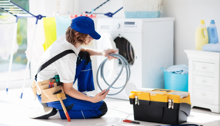 handyman repairing washer and dryer repair