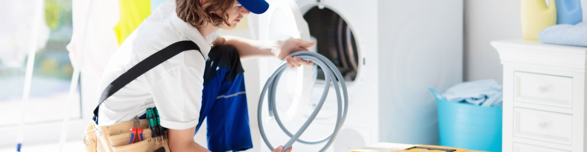 handyman repairing washer and dryer repair